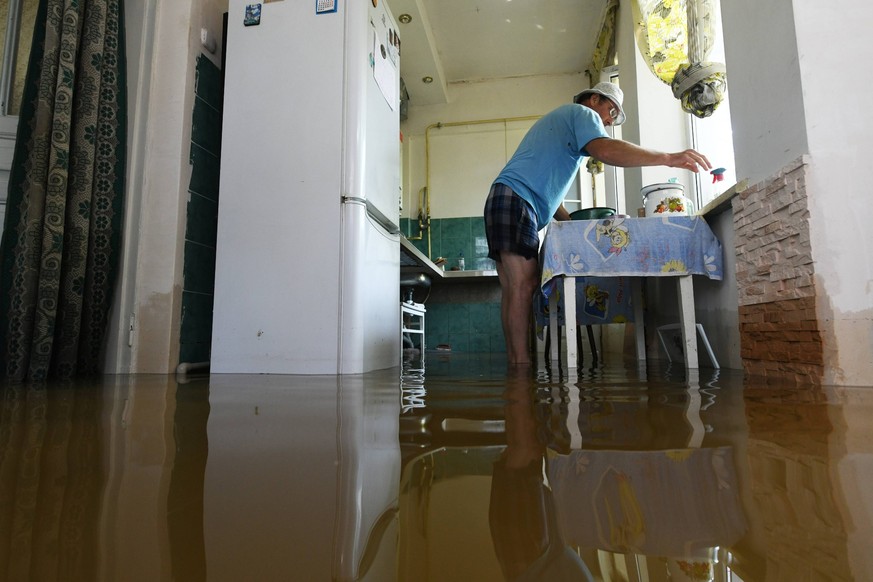 A local resident at his home in Novaya Kakhovka after the Kakhovka dam was destroyed.