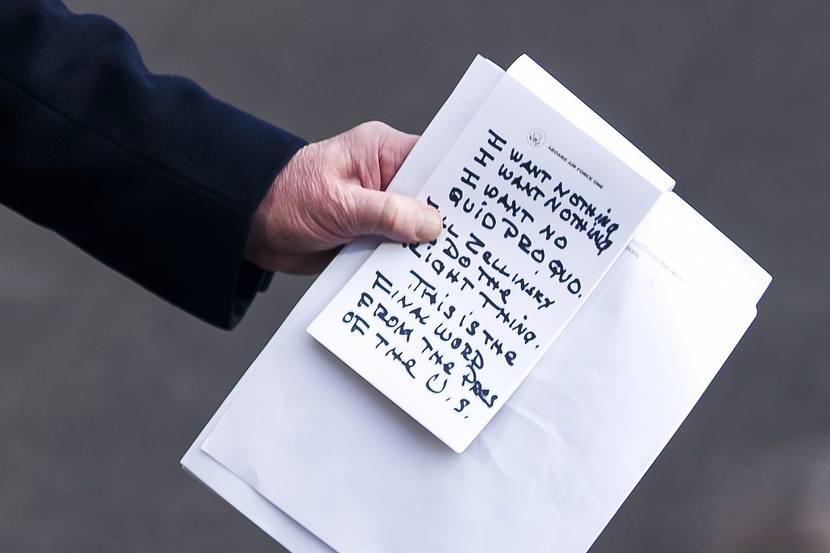 epa08939622 (FILE) A close-up view of US President Donald J. Trump's notes as he speaks to the media about the impeachment proceedings as he departs for a tour of an Apple facility in Austin, Tex ...