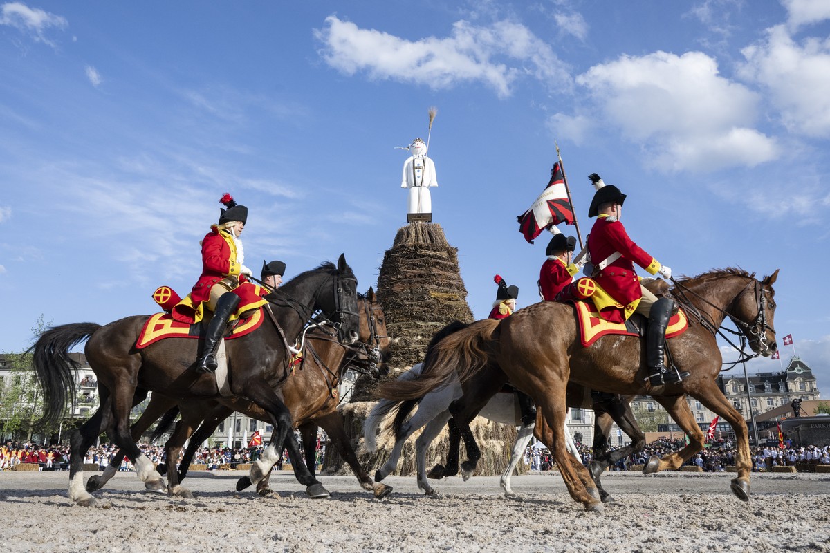 Men ride horses in the front of the "Boeoegg" on the Sechselaeuten place in Zurich, Switzerland, pictured on April 15, 2024. The Sechselaeuten (ringing of the six o'clock bells) is a tr ...