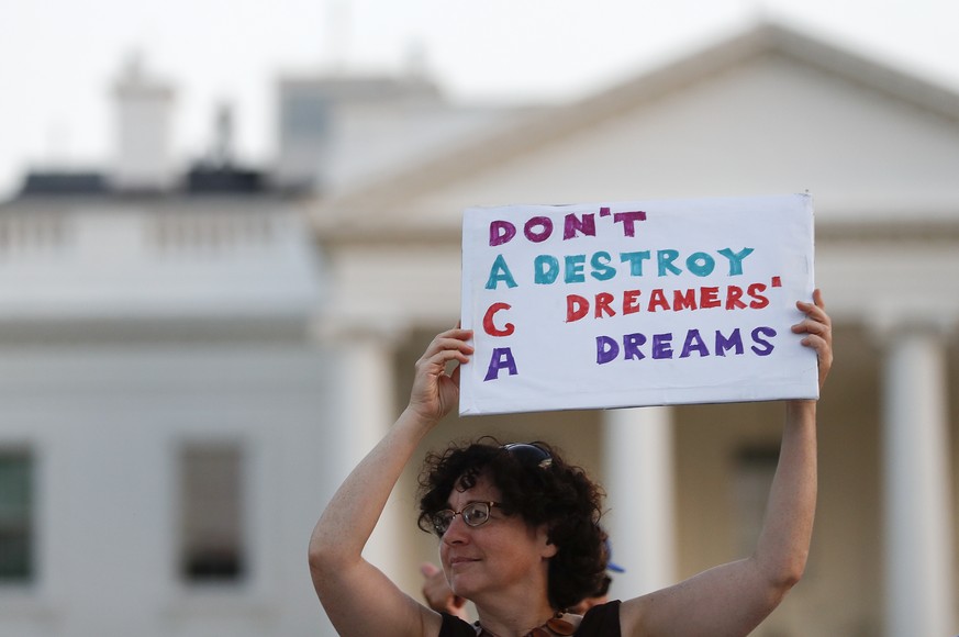 Julia Paley, of Arlington, Va., with the DMV Sanctuary Congregation Network, holds up a sign that reads &quot;DACA Don&#039;t Destroy Dreamers Dreams&quot; during a rally supporting Deferred Action fo ...