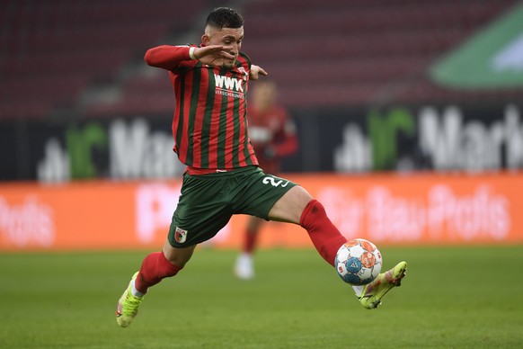 Augsburg&#039;s Andi Zeqiri takes control of the ball during the German Bundesliga soccer match between Eintracht Frankfurt and FC Augsburg at the WWK Arena in Augsburg, Germany, Sunday, Jan. 16, 2022 ...