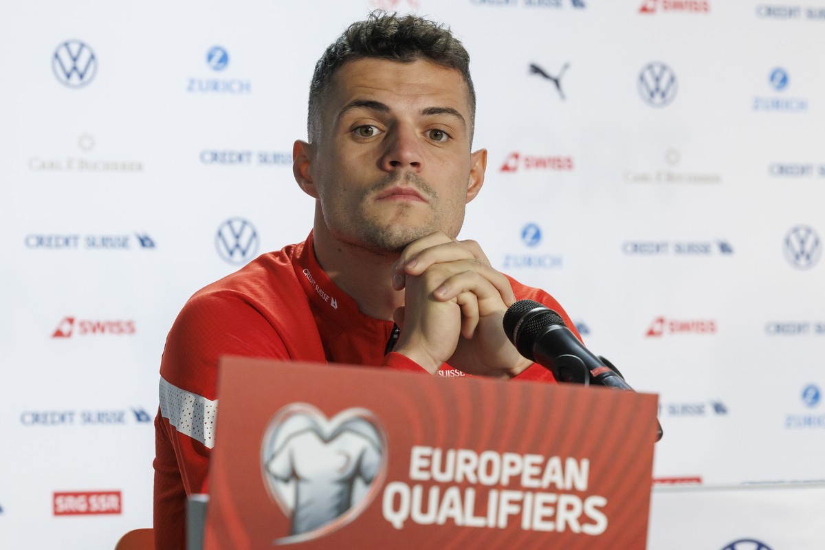 epa10545493 Switzerland's midfielder Granit Xhaka speaks to the media during a press conference in Geneva, Switzerland, 27 March 2023. Switzerland will play against Israel in their UEFA EURO 2024 ...