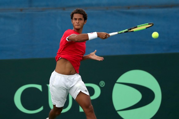 epa07487120 Peruvian tennis player Juan Pablo Varillas in action against Salvadoran Alberto Alvarado during a Davis Cup first round group II match between El Salvador and Peru, in San Salvador, El Sal ...