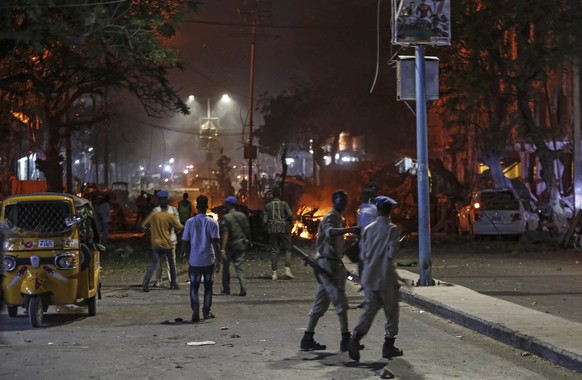 epa07404871 Security officers gather at the scene of a car bomb explosion in Mogadishu, Somalia, 28 February 2019. According to a media report, at least 5 people were killed in a blast that destroyed  ...