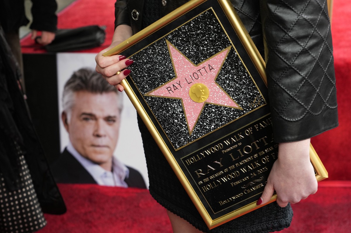 The late actor Ray Liotta's daughter Karsen holds a replica of a posthumous star for her father following a ceremony for him on the Hollywood Walk of Fame, Friday, Feb. 24, 2023, in Los Angeles.  ...