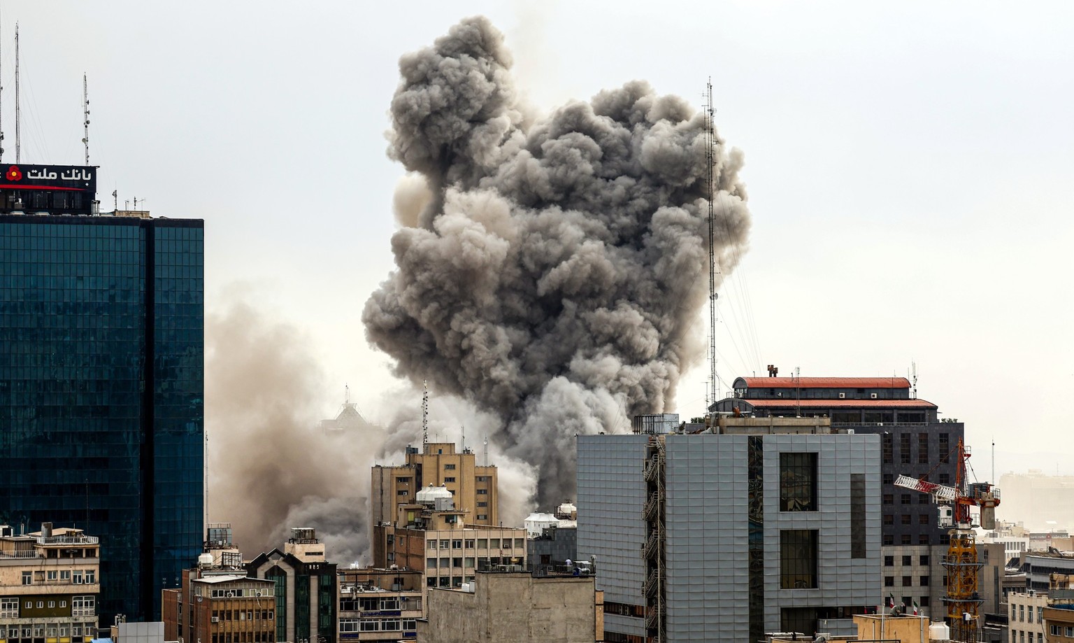 TEHRAN, IRAN - MARCH 02: A general view of Tehran with smoke visible in the distance after explosions were reported in the city, on March 02, 2026 in Tehran, Iran. (Photo by Contributor/Getty Images)