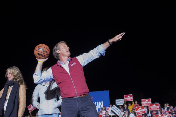 Republican gubernatorial candidate Glenn Youngkin throws a basketball into the crowd after speaking to supporters at a campaign rally in Leesburg, Va., Monday, Nov. 1, 2021. (AP Photo/Cliff Owen)