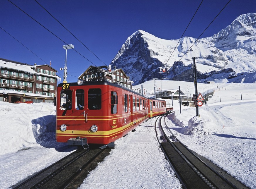 A train of the Jungfraubahn railway departs from the station on the Kleine Scheidegg to go back to Wengen in the Bernese Oberland, Switzerland, pictured on March 2, 2005. The Eiger mountain with the E ...