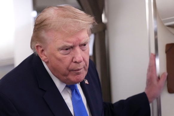 President Donald Trump speaks to reporters onboard Air Force One while returning to the White House, Sunday, Aug. 2, 2026. (AP Photo/Jacquelyn Martin)
Donald Trump