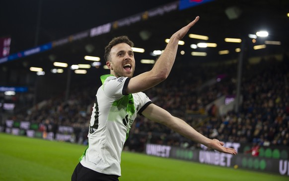 epa11044918 Diogo Jota of Liverpool celebrates after scoring the second goal during the English Premier League soccer match between Burnley FC and Liverpool FC, in Burnley, Britain, 26 December 2023.  ...