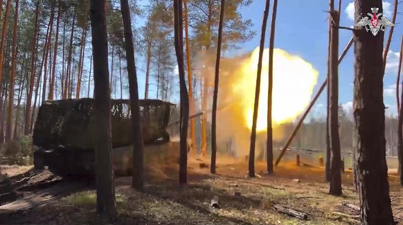 In this photo, taken from video released by Russian Defense Ministry Press Service on Monday, June 9, 2025, a Russian T-90 tank fires towards a Ukrainian position on an undisclosed location in Ukraine ...