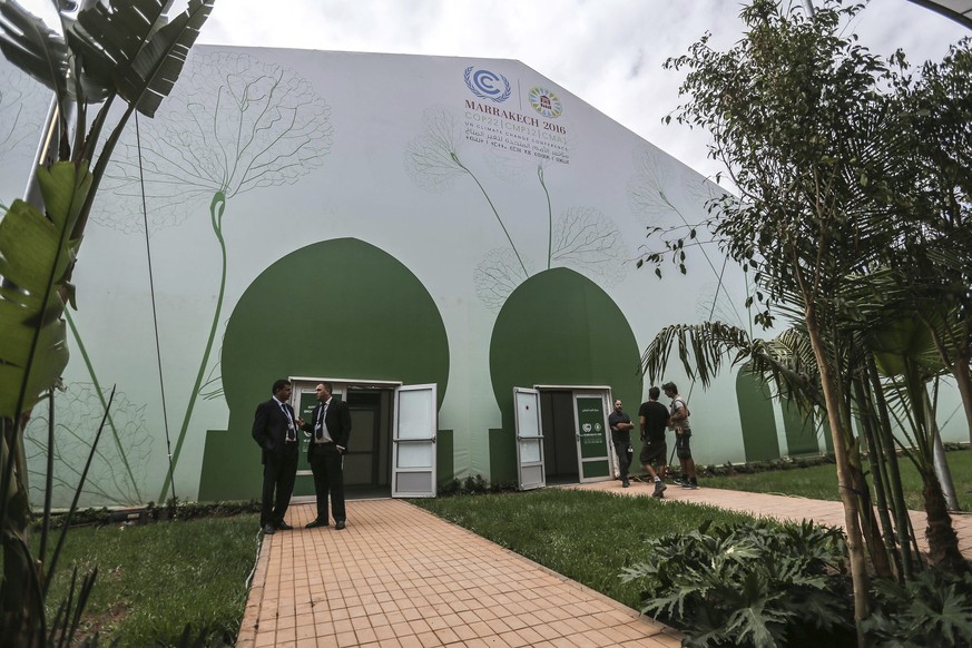 Members of the press and participating delegates gather at the COP22 village, a day ahead of the opening ceremony, in Marrakesh, Morocco, Sunday, Nov. 6, 2016. The Climate Conference, known as the COP ...