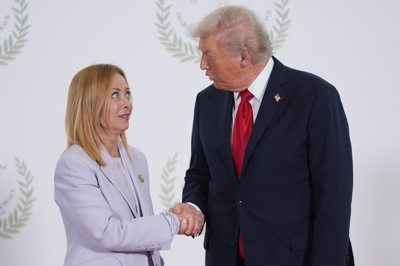 President Donald Trump greets Italy's Prime Minister Giorgia Meloni during summit to support ending the more than two-year Israel-Hamas war in Gaza after a breakthrough ceasefire deal, Monday, Oc ...