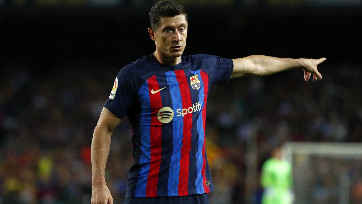 Barcelona&#039;s Robert Lewandowski gestures during a Spanish La Liga soccer match between FC Barcelona and Celta Vigo at Camp Nou stadium in Barcelona, Spain, Sunday, Oct. 9, 2022. (AP Photo/Joan Mon ...