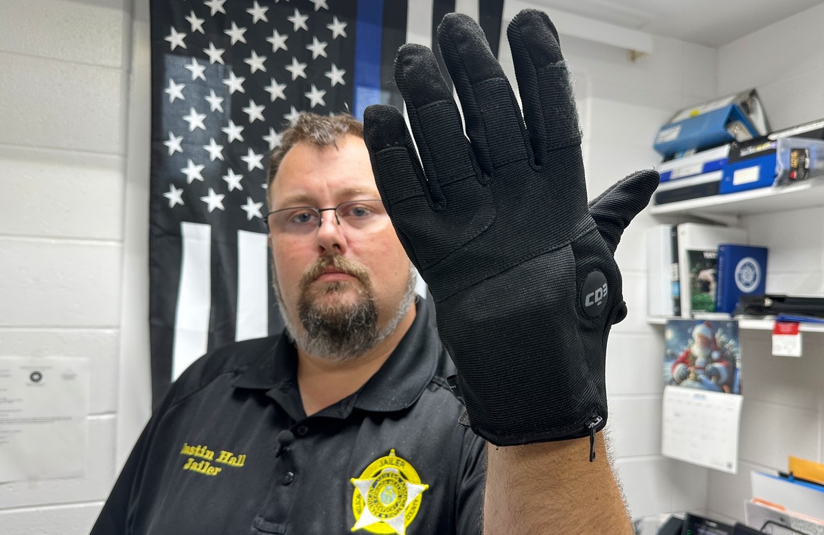 Nelson County, Ky., jailer Justin Hall shows an electric shock glove that is used at his facility, Thursday, Aug. 13, 2026, in Bardstown, Ky. (AP Photo/Dylan Lovan)
Immigration ICE Shock Gloves