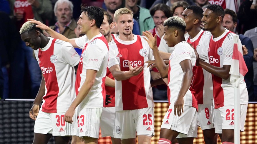 epa09475645 (lr) Mohamed Daramy of Ajax celebrates the 6-0 with Steven Berghuis of Ajax, Kenneth Taylor of Ajax, David Neres of Ajax, Ryan Gravenberch of Ajax, Sebastien Haller of Ajax during the Dutc ...