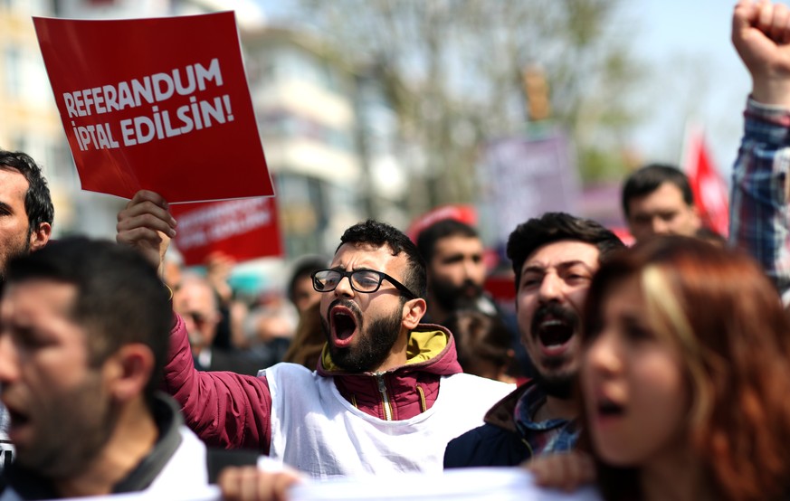 epa05923975 Protesters shout slogans and they hold signs reading, &#039;Cancel referendum&#039; during a rally against the referendum results in Istanbul, Turkey, 23 April 2017. Media reports Turkish  ...