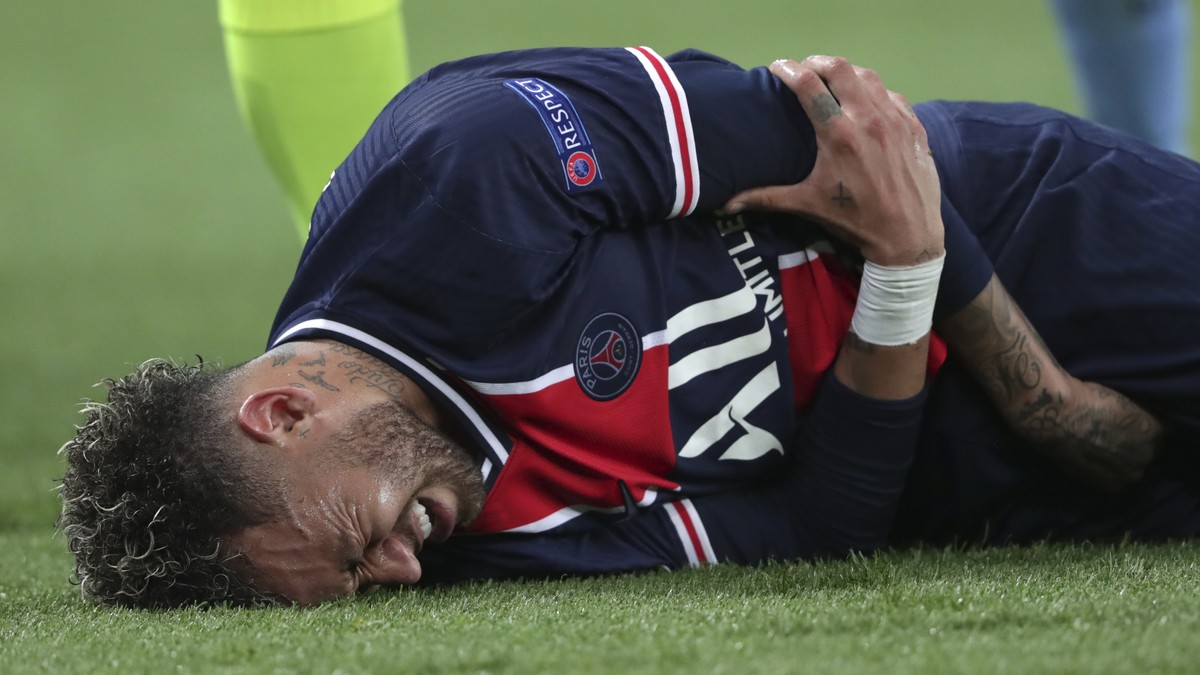 PSG's Neymar holds his arm during the Champions League semifinal first leg soccer match between Paris Saint Germain and Manchester City at the Parc des Princes stadium, in Paris, France , Wednesd ...