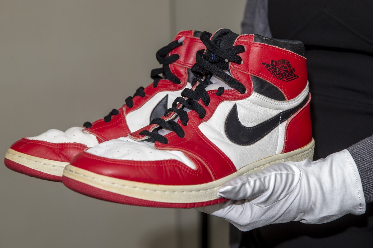 A person shows shoes of former NBA player Michael Jordan Game Worn 1985 Player Sample Air Jordan 1s estimated to sell between 100'000 - 150'000 CHF, during a preview at the Sotheby's pr ...
