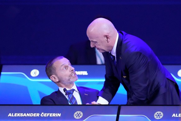 FILE - FIFA President Gianni Infantino, right, talks to UEFA President Aleksander Ceferin during the FIFA 75th Congress at the Conmebol Convention Center in Luque, Paraguay, Thursday, May 15, 2025. (A ...