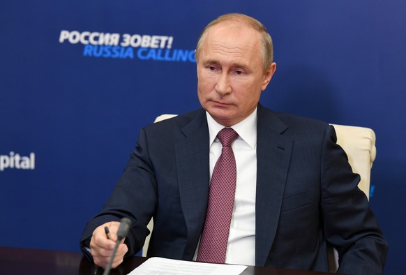 Russian President Vladimir Putin attends an annual VTB Capital &quot;Russia Calling!&quot; Investment Forum via video conference at the Novo-Ogaryovo residence outside Moscow, Russia, Thursday, Oct. 29, 2020. (Alexei Nikolsky, Sputnik, Kremlin Pool Photo via AP)
