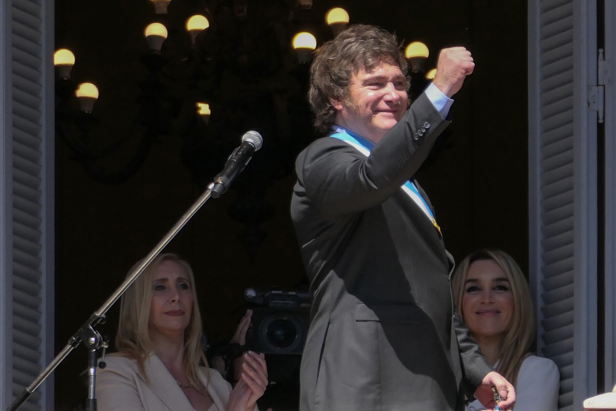 epa11022276 The president of Argentina, Javier Milei, gestures at the end of his speech on the balcony of the Casa Rosada in Buenos Aires, Argentina, 10 December 2023. Milei arrived at the Casa Rosada ...