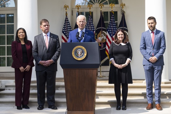 epa10185975 US President Joe Biden (C), along with Deputy Secretary of Labor Julie Su (L), Labor Secretary Marty Walsh (C-L), Director of Made in America at the Office of Management and Budget, Celest ...