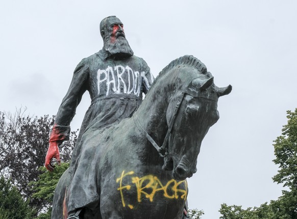 epa08476653 A statue of King Leopold II of Belgium after it was smeared in the night in Brussels, Belgium, 10 June 2020. At least two petitions were launched to remove all statues in honor of the colo ...