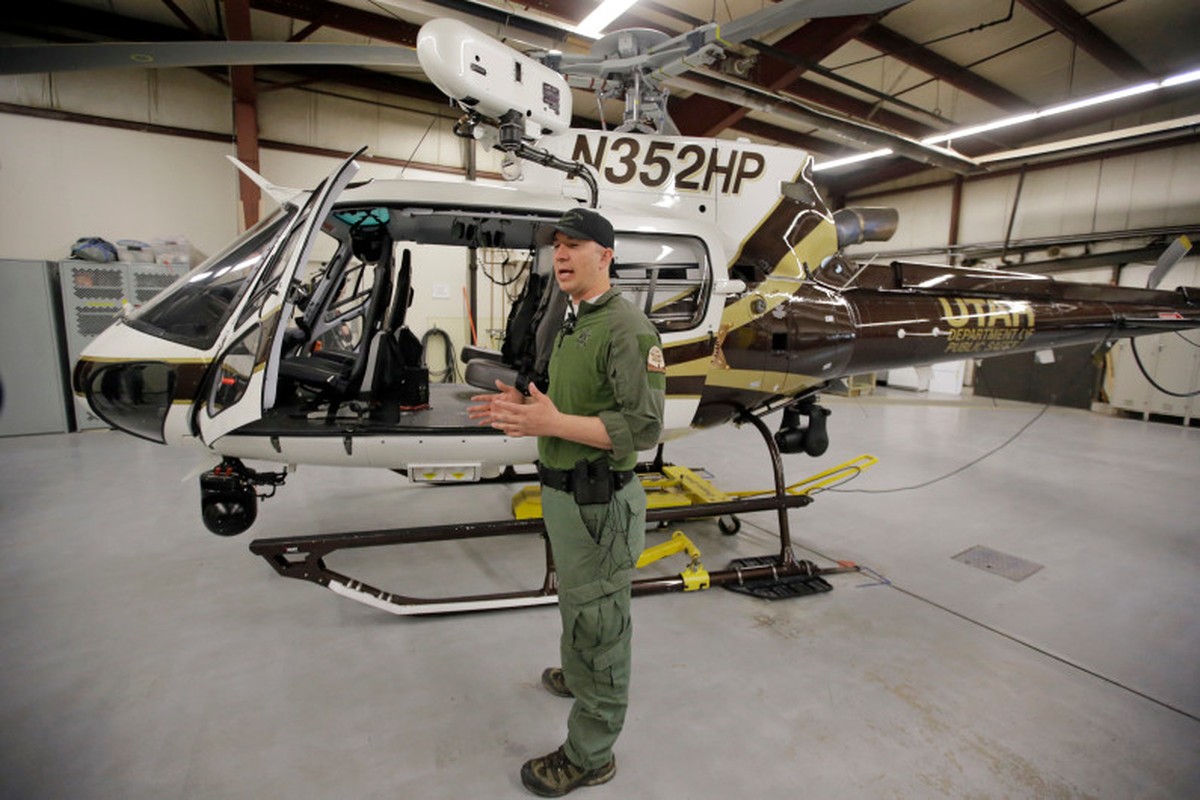 Utah Department of Public Safety's helicopter pilot Luke Bowman speaks during a news conference Monday, April 3, 2017, in Salt Lake City. During a search and rescue call for a missing kayaker, th ...