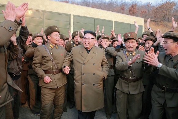 North Korean leader Kim Jong Un watched the ground jet test of a Korean-style high-thrust engine newly developed by the Academy of the National Defence Science in this undated picture provided by KCNA ...