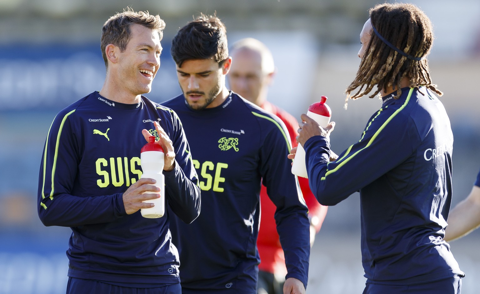 Switzerland&#039;s national soccer team player Stephan Lichtsteiner left and Kevin Mbabu right during a training before the upcoming UEFA Euro 2020 qualifying soccer matchs, at the Stade Olympique de  ...