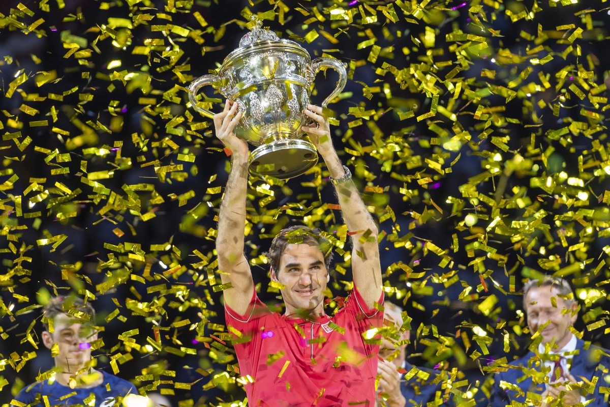 Switzerland's Roger Federer cheers after winning his tenth title at the Swiss Indoors tennis tournament at the St. Jakobshalle in Basel, Switzerland, on Sunday October 27, 2019. (KEYSTONE/Georgio ...