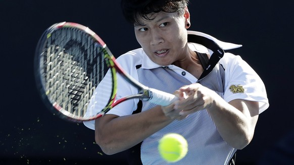 epa06439906 Luksika KumKhum of Thailand in action during her first round match against Johanna Larsson of Sweden at the Australian Open Grand Slam tennis tournament in Melbourne, Australia, 15 January ...