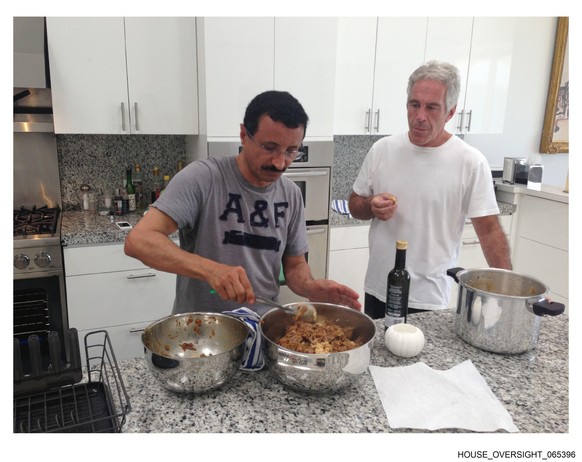 This undated photo released by Democrats on the House Oversight Committee Thursday, Dec. 18, 2025, shows Jeffrey Epstein talking with Sultan Ahmed bin Sulayem, the CEO of DP World. (House Oversight Co ...