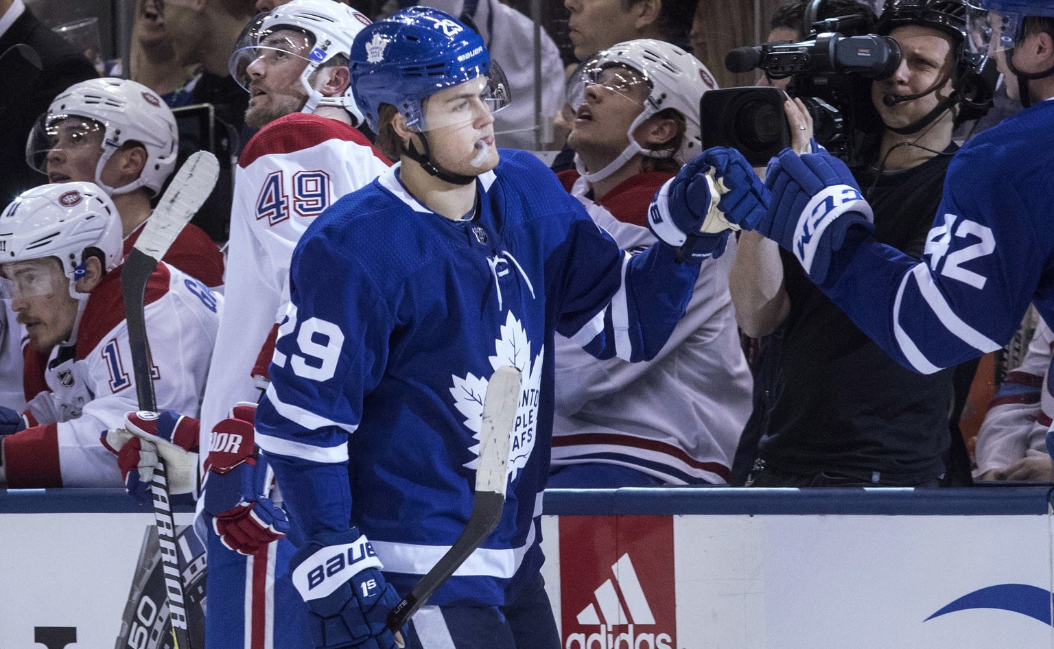 Toronto Maple Leafs&#039; William Nylander celebrates at the team bench after scoring against the Montreal Canadiens during the first period of an NHL hockey game Saturday, March 17, 2018, in Toronto. ...