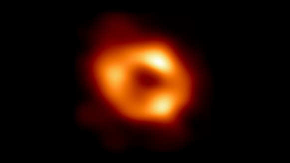 This is the first image of Sgr A*, the supermassive black hole at the centre of our galaxy, with an added black background to fit wider screens. It’s the first direct visual evidence of the presence o ...