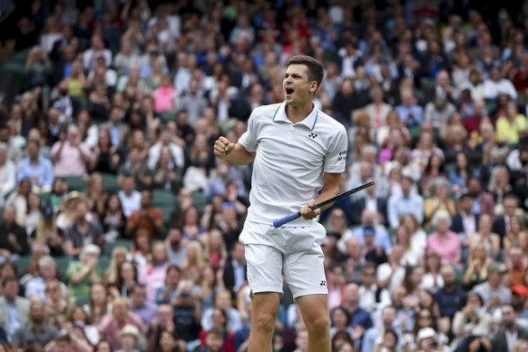 epa09325595 Hubert Hurkacz of Poland reacts at the end of his 4th round match against Daniil Medvedev of Russia at the Wimbledon Championships, Wimbledon, Britain 06 July 2021. EPA/VICKIE FLORES EDITO ...