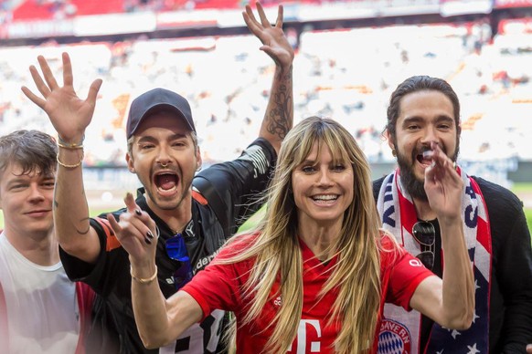MUNICH, GERMANY - MAY 18: Bill Kaulitz, Heidi Klum and Tom Kaulitz gesture prior to the Bundesliga match between FC Bayern Muenchen and Eintracht Frankfurt at Allianz Arena on May 18, 2019 in Munich,  ...