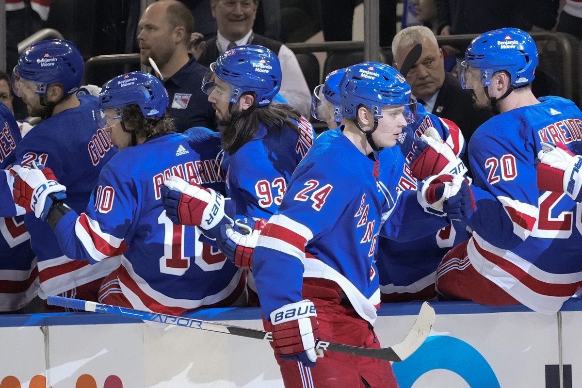 New York Rangers' Kaapo Kakko (24) celebrates with teammates after scoring a goal against the Tampa Bay Lightning during the first period of an NHL hockey game Wednesday, April 5, 2023, in New Yo ...