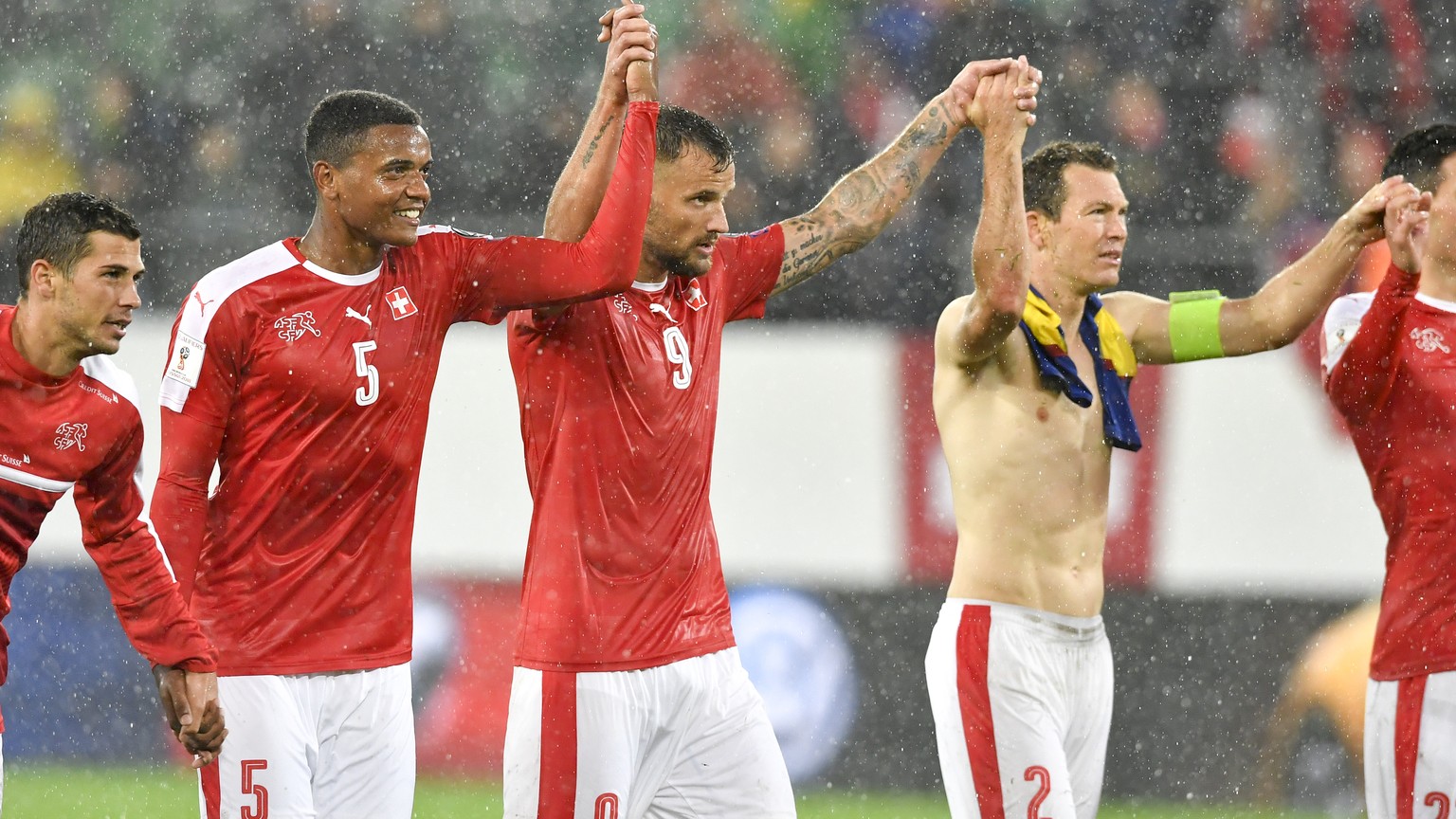 From left, Swiss soccer players Remo Freuler, Manuel Akanji, Haris Seferovic, Stephan Lichtsteiner celebrate after winning the 2018 Fifa World Cup Russia group B qualification soccer match between Swi ...