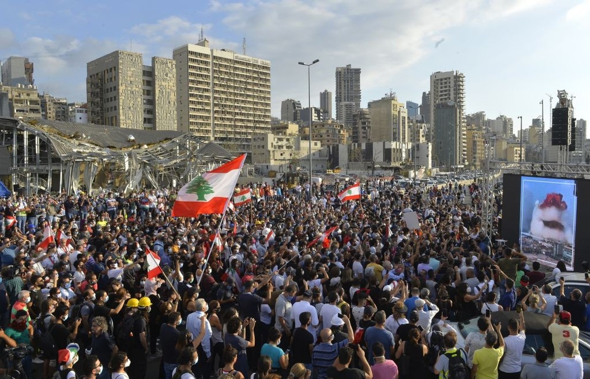 BEIRUT, LEBANON - AUGUST 11: Lebanese demonstrators gather to march towards the parliament building following the resignation of Lebanese government, during the fourth day of the demonstration after a ...