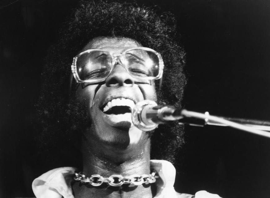 BETHEL, NY - AUGUST 17: Musician Sly Stone of the psychedelic soul group "Sly And The Family Stone" performs at the 1969 Woodstock Festival on August 17, 1969 in Bethel, New York. (Photo by ...