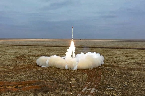 FILE - This photo from a video released by the press service of the Russian Ministry of Defense on Saturday, February 19, 2022 shows a Russian Iskander-K missile launched during a military exercise at a training center...