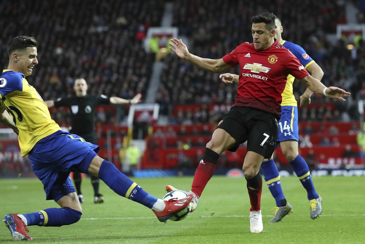 Southampton's Jan Bednarek, left, challenges Manchester United's Alexis Sanchez during their English Premier League soccer match at Old Trafford, Manchester, England, Saturday, March 2, 2019 ...