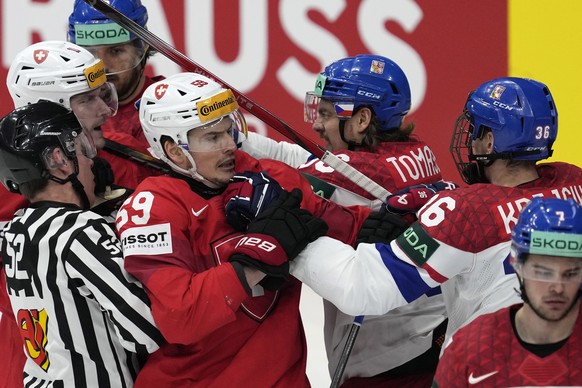 Switzerland's Dario Simion (59) and Czech Republic's Jakub Krejcik (36) scuffle during the gold medal match between Czech Republic and Switzerland at the Ice Hockey World Championships in Pr ...