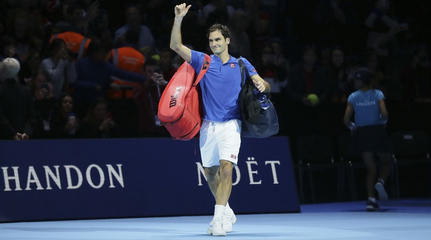 Roger Federer of Switzerland walks off court after losing to Alexander Zverev of Germany in their ATP World Tour Finals singles tennis match at the O2 Arena in London, Saturday Nov. 17, 2018. (AP Phot ...