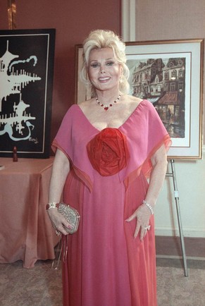 FILE -- In a June 8, 1990 file photo Zsa Zsa Gabor smiles at a charity auction in Beverly Hills, Calif. A representative for Gabor said Sunday Jan. 2, 2011 that she is back in a Los Angeles hospital t ...