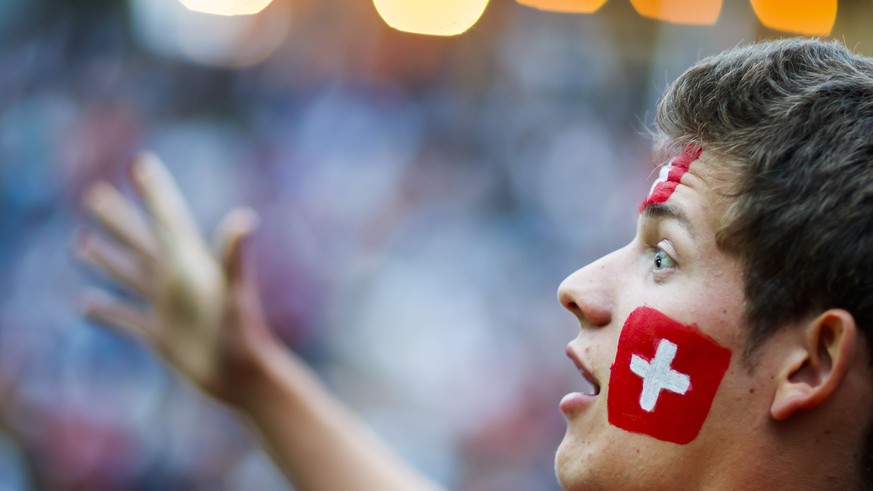 A Swiss supporter reacts during the public viewing of the FIFA 2018 World Cup Group E soccer match between Switzerland and Brazil, in a fan zone in Lausanne, Switzerland, Sunday, June 17, 2018. (KEYST ...