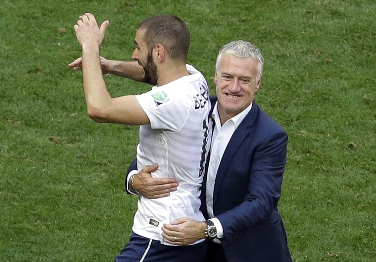 France's head coach Didier Deschamps, right, celebrates with Karim Benzema after the World Cup round of 16 soccer match between France and Nigeria at the Estadio Nacional in Brasilia, Brazil, Mon ...