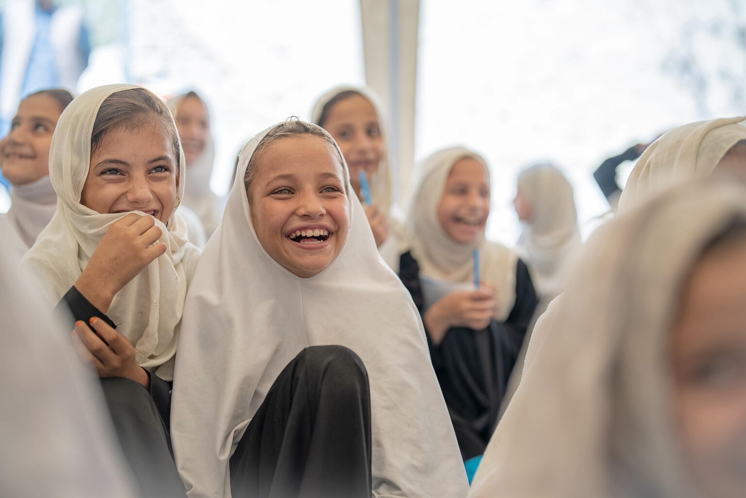 On 12th September 2023, 8 year old Maria (centre) and a friend attend a UNICEF-supported Community-Based Education Centre in Behsood District, Nangarhar Province, Afghanistan.